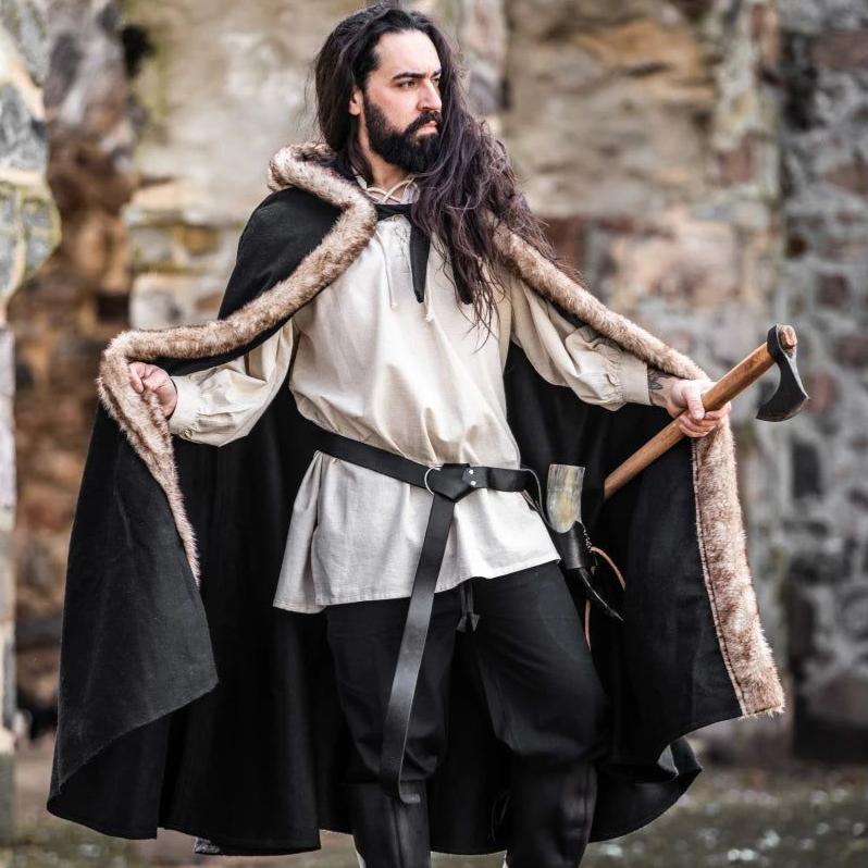Renaissance black wool cloak with luxurious faux fur trim and short hood, worn by a man holding an axe.