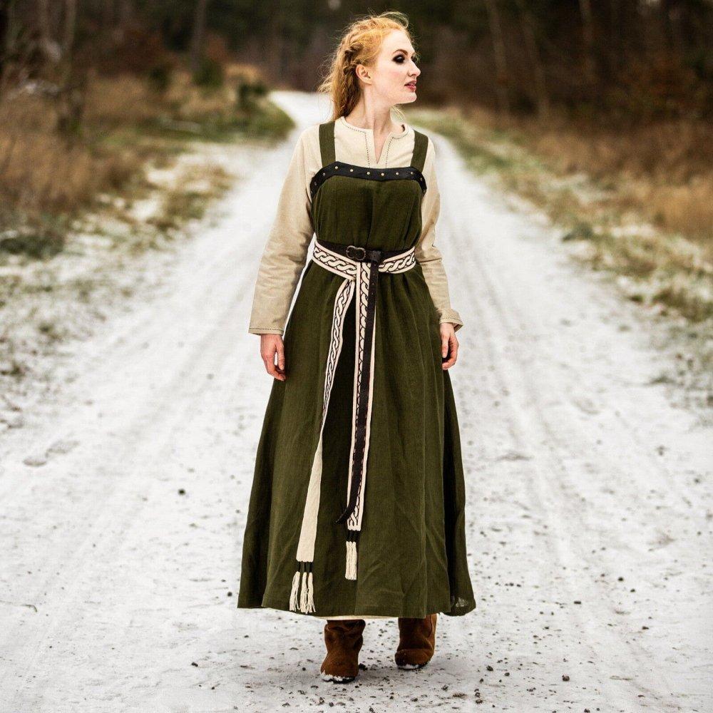 Renaissance green linen over dress with wide straps and side ties, worn over a beige underdress.