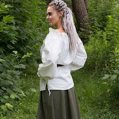 Renaissance white crepe cotton loose-fit blouse with adjustable drawstrings, worn by a woman in a forest.