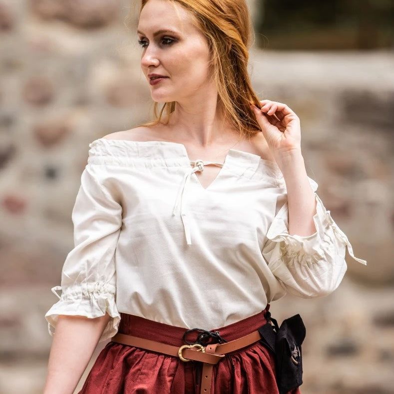 White Renaissance blouse with off-shoulder neckline, lace, and elbow-length sleeves.