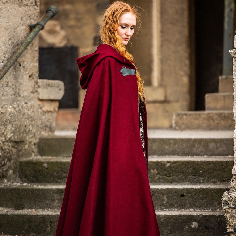 Red wool cloak laid flat showing its full width