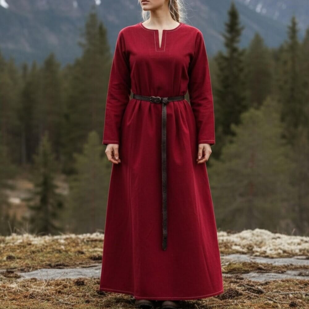 Woman wearing Renaissance Dress or Underdress - Rich Red, long crimson gown with simple neckline and brown belt, standing outdoors.