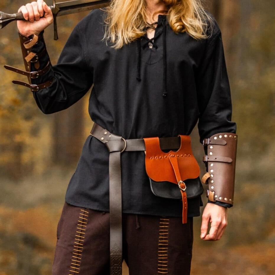 Black cotton Renaissance shirt with long sleeves and a lace-up collar, worn by a person holding a sword.