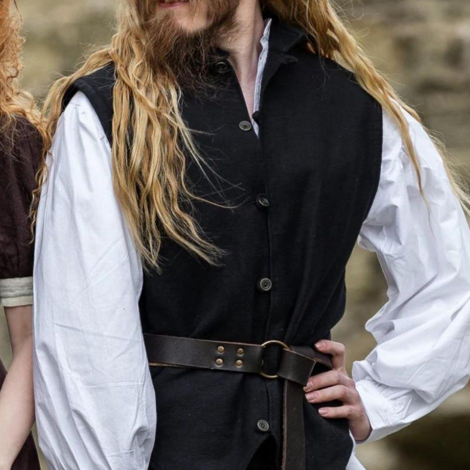 Black handwoven cotton Renaissance vest with metal closures, worn over a white shirt.