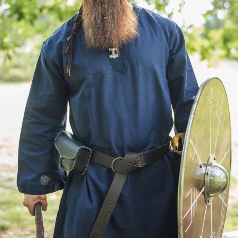 Blue cotton Renaissance tunic with embroidered trim, worn by a man with a shield and belt.
