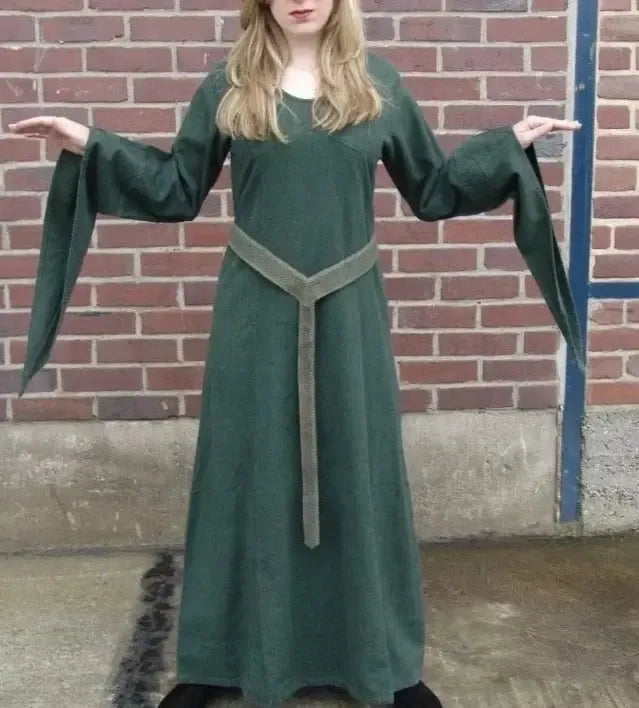 Green Renaissance Y-shaped cotton fabric belt with a draping front panel, worn over a dark green gown.