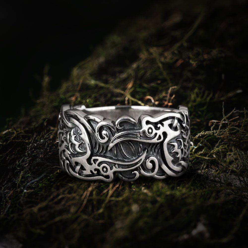 Sterling silver Renaissance ring with detailed raven and ornate scrollwork design.