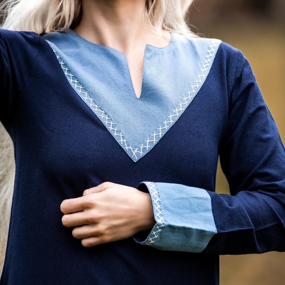 Dark blue Renaissance dress with light blue V-neck, cross-stitch embroidery, and long sleeves.