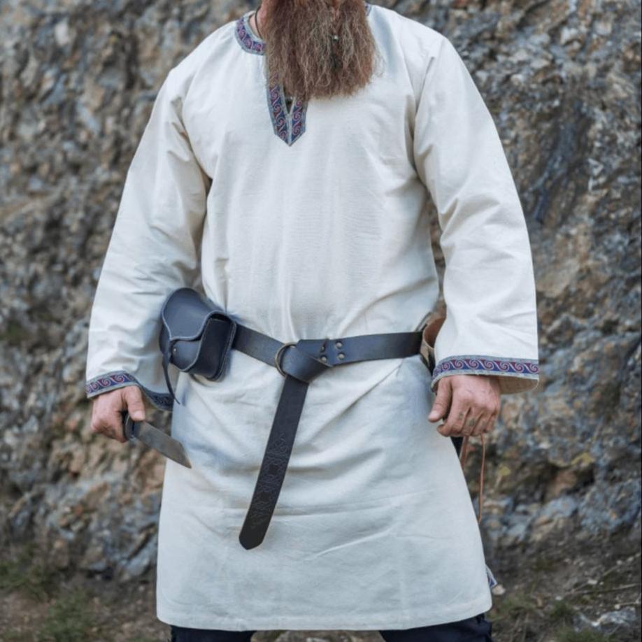 Natural cotton Renaissance tunic with embroidered trim at neck and sleeves, knee-length.