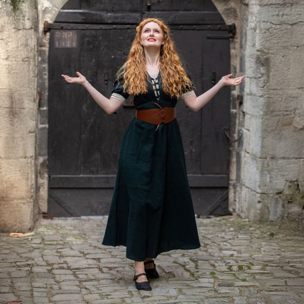 Renaissance summer dress in dark green cotton with laced front, short sleeves, and a brown leather belt.