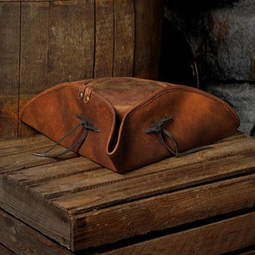 Brown pull-up leather Renaissance tricorn hat with three-corner fold and black ties.