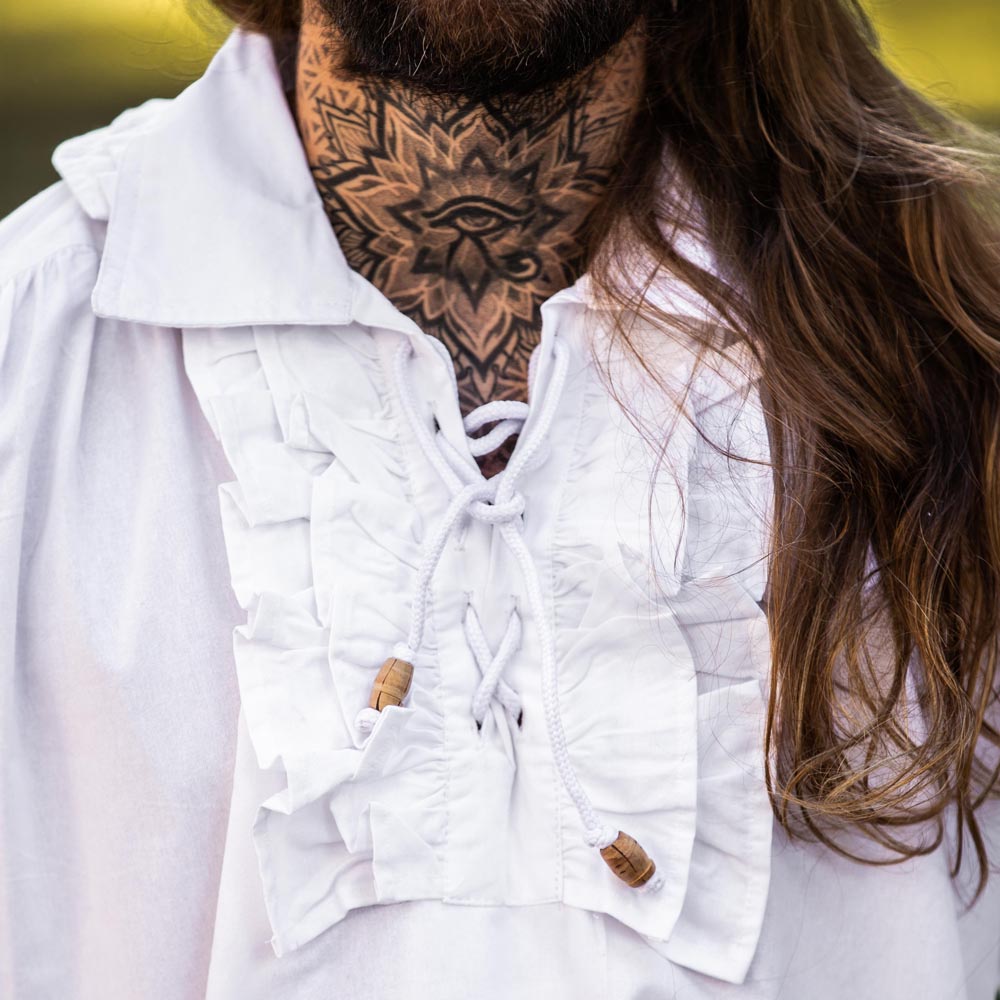 White cotton Renaissance shirt with ruffled neckline, lace-up front, and long sleeves.